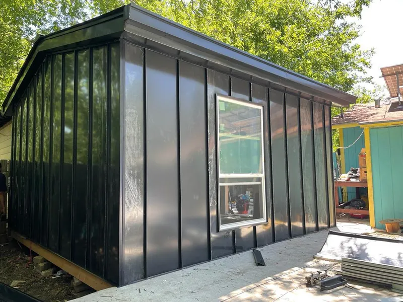 Black standing seam metal wall panels for Roof Inspection in Forestbrook