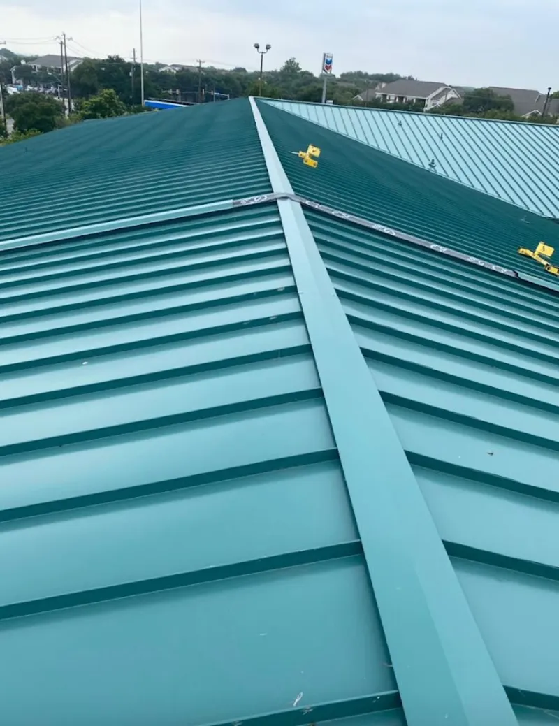 Green commercial metal roof ridge and valley for Metal Roof Repair in Forestbrook